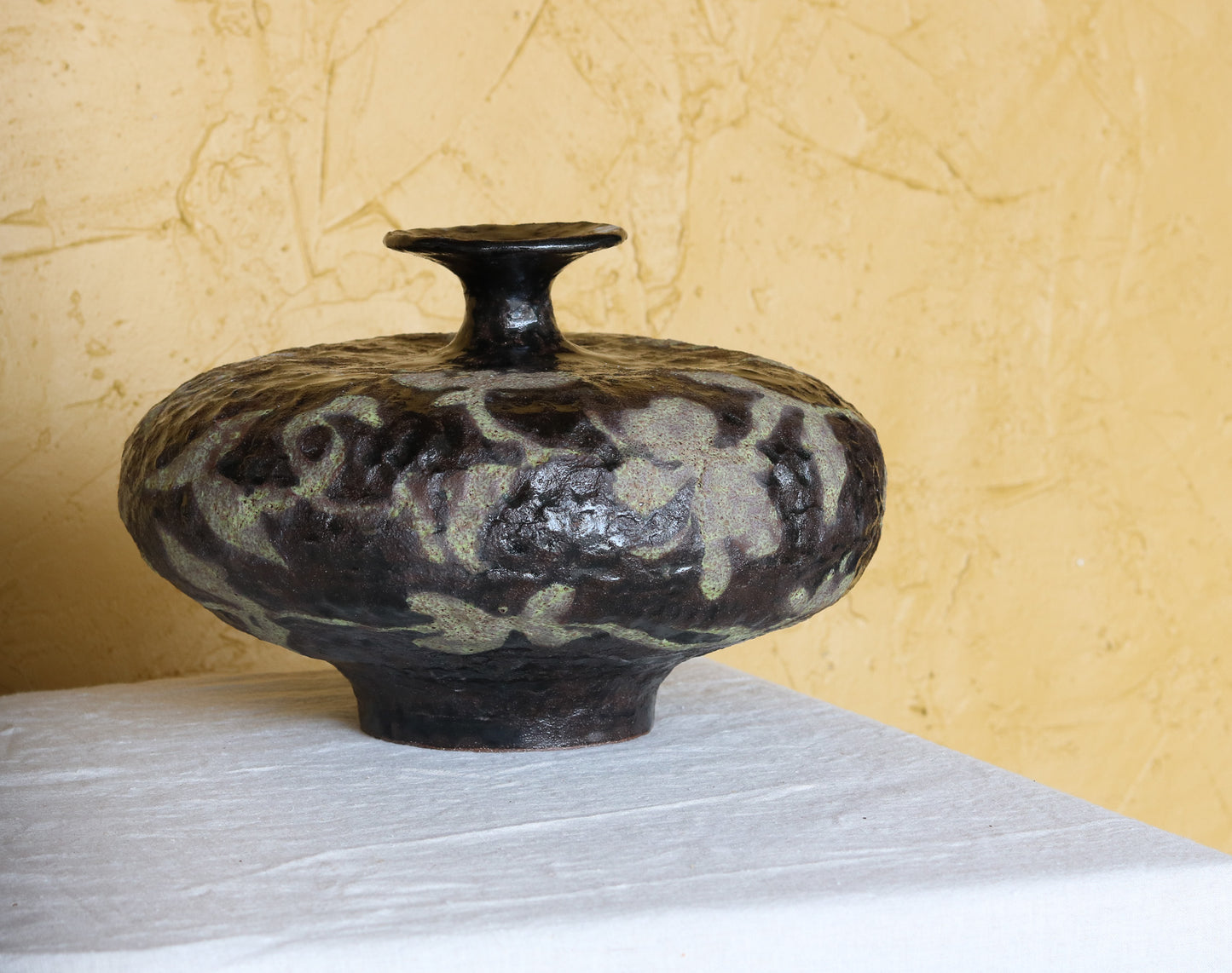Stout Noir Vessel with Vine and Floral detail.
